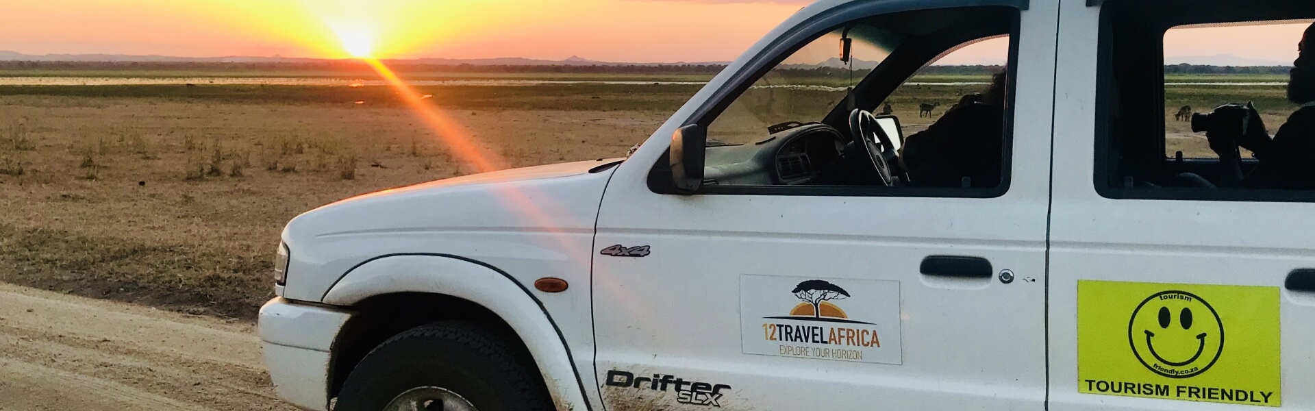 The car of 1 2 Travel Africa at sunset